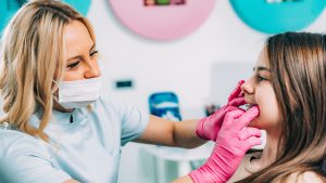 Young girl at the orthodontist being worked on