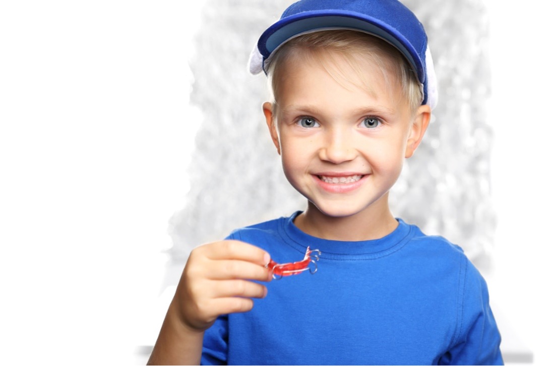 A picture containing person, child, young, little, retainers