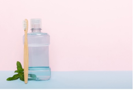 A picture containing fluoride mouth rinse and toothpaste