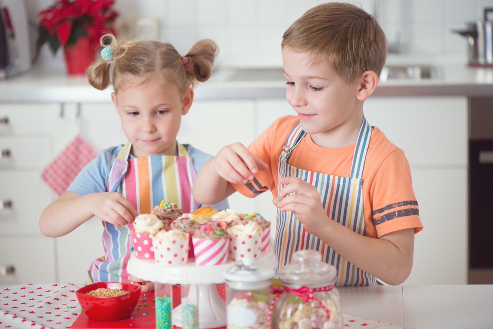 A couple of kids decorating cupcakes, Children’s Orthodontic Care